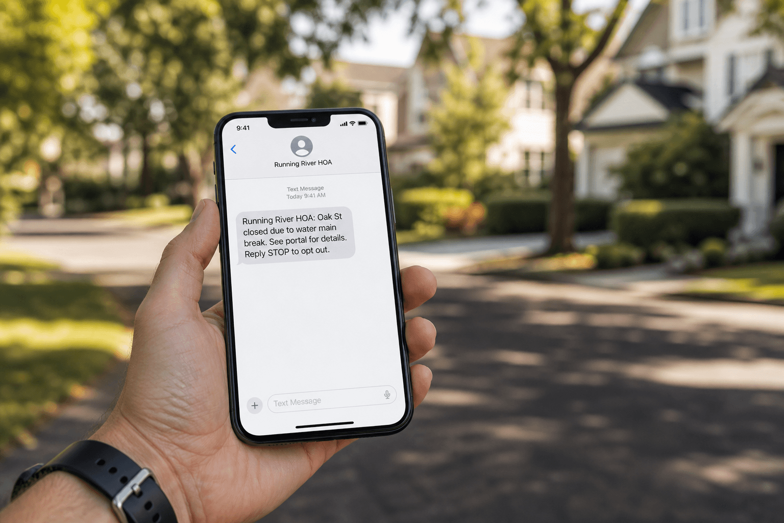 Resident holding a phone with a Running River HOA BOLO text message